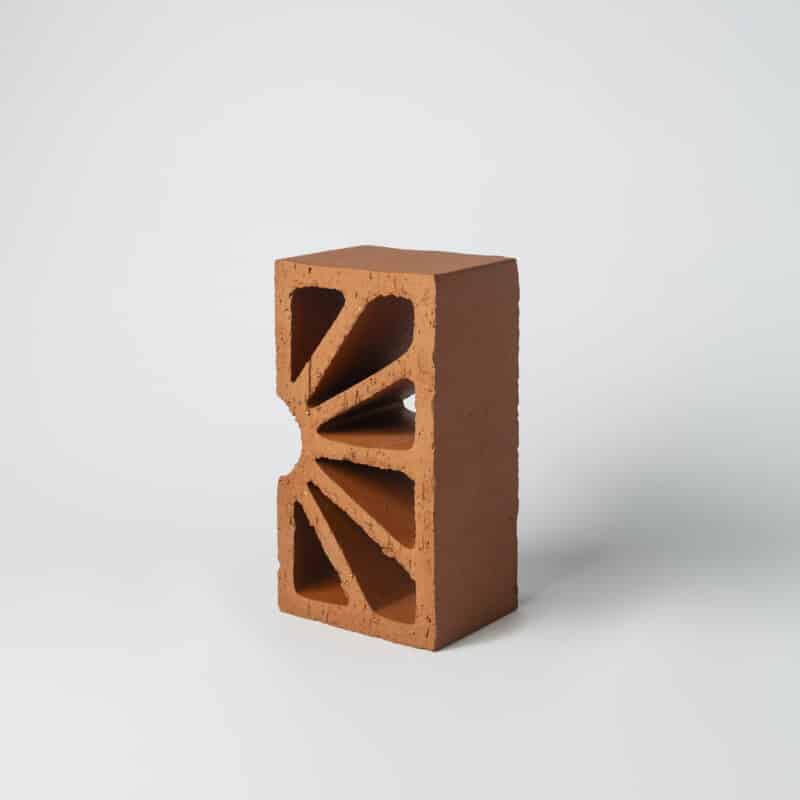 Terracotta screen/breeze block shaped like a sunrise