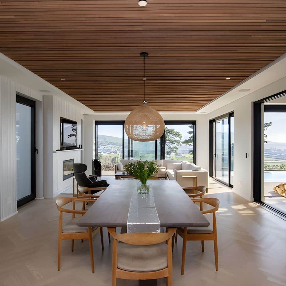 energy project tectured cladding & surfaces with large windows allowing natural light to illuminate the room setting