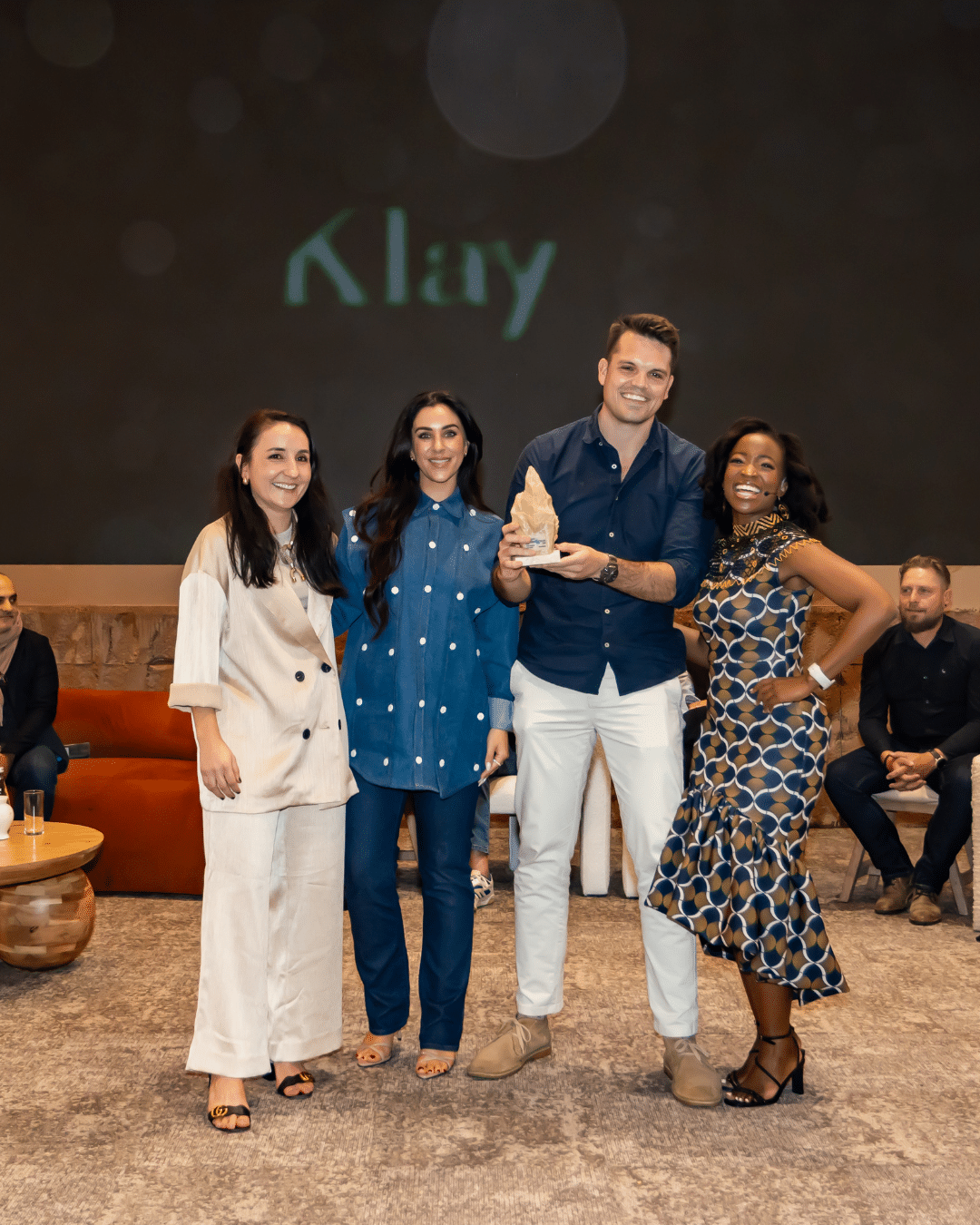 Klay accepts the Brand of the Year award on Stage at Scape's Design Emporium event